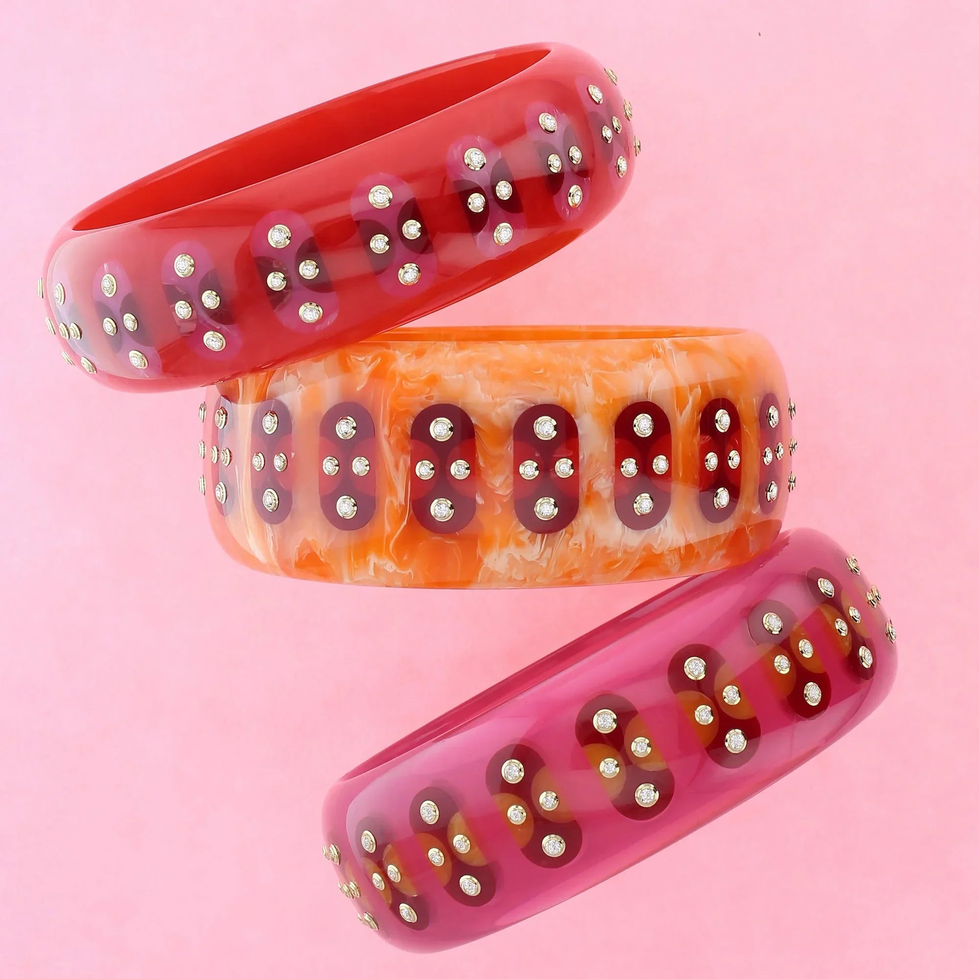 Adler Bangle | Brilliant orange bakelite with inlay and stones.
