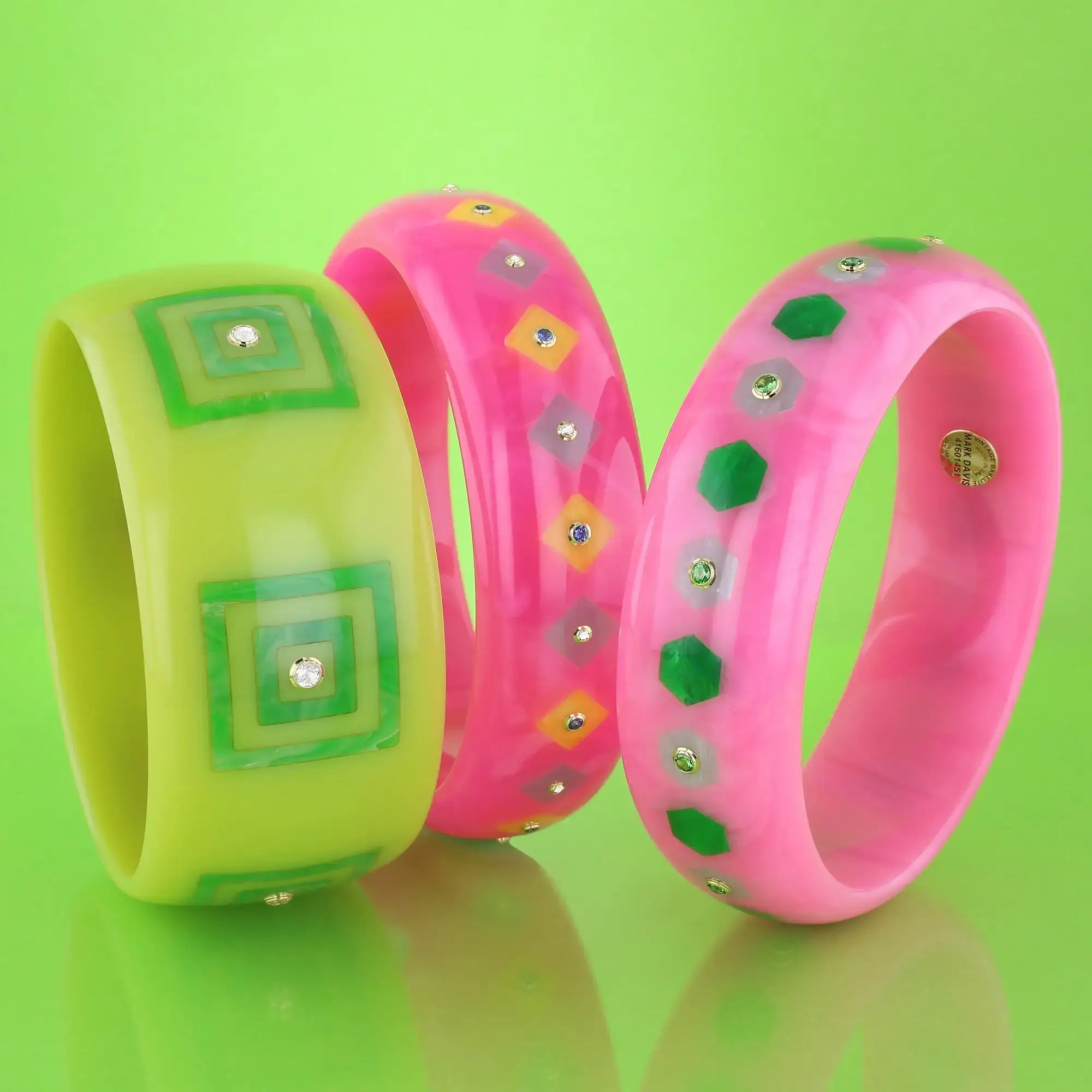 Lia Bangle | Bright pink bakelite with inlay and stones.