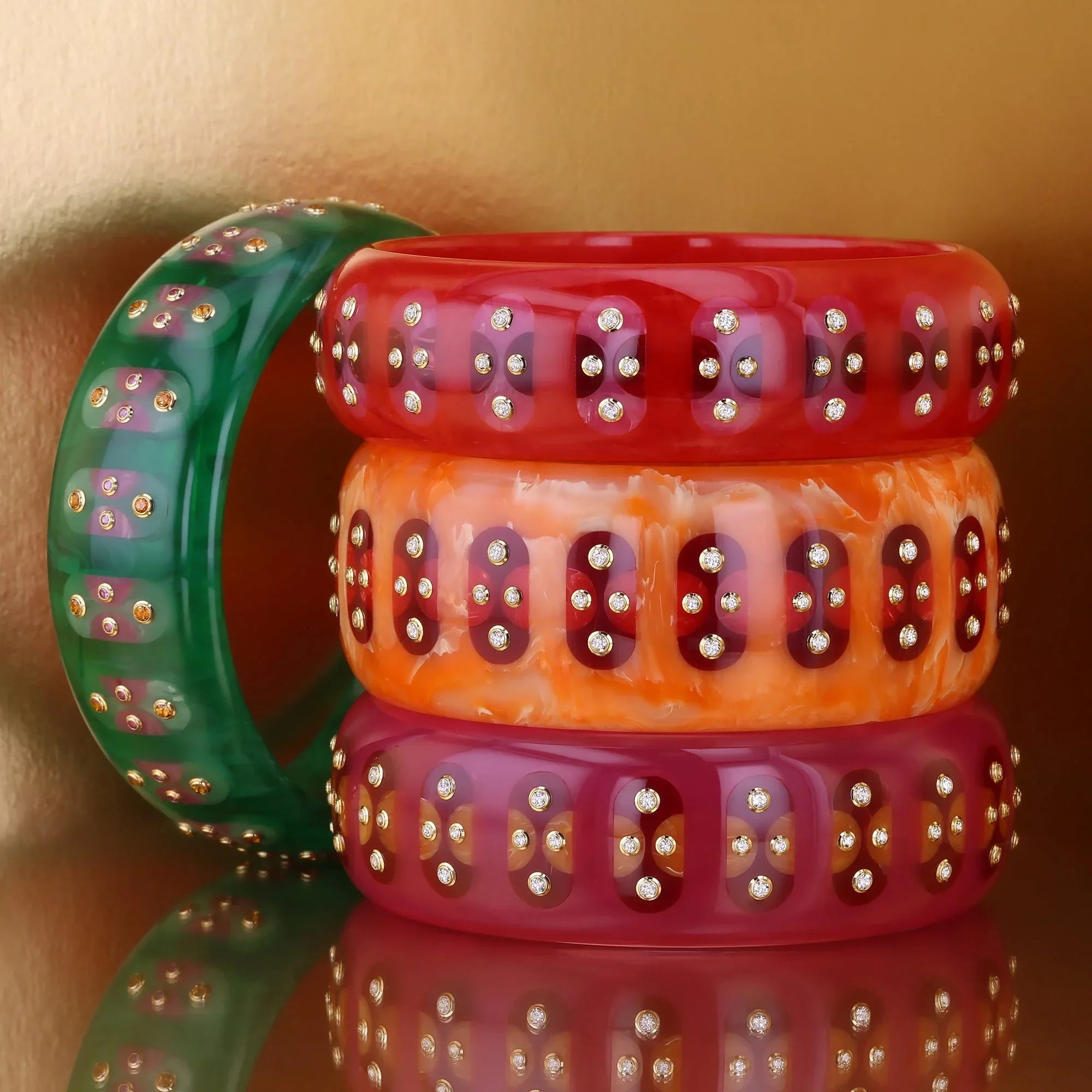 Adler Bangle | Brilliant orange bakelite with inlay and stones.