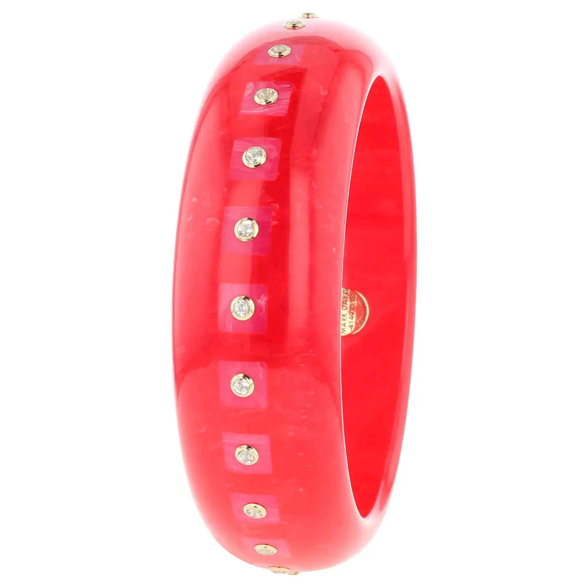 Katherine Bangle | Tart red bakelite with inlay and stones.