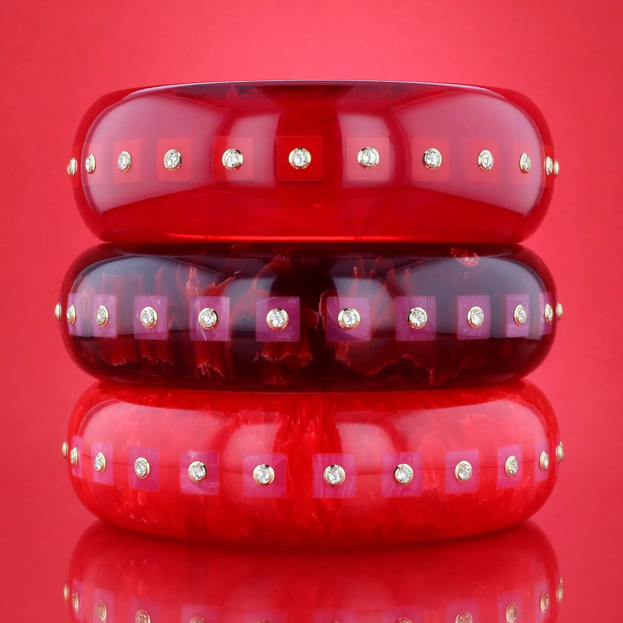 Katherine Bangle | Tart red bakelite with inlay and stones.