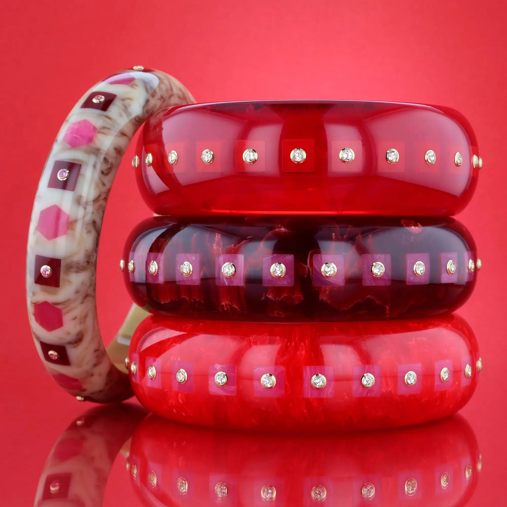 Katherine Bangle | Tart red bakelite with inlay and stones.